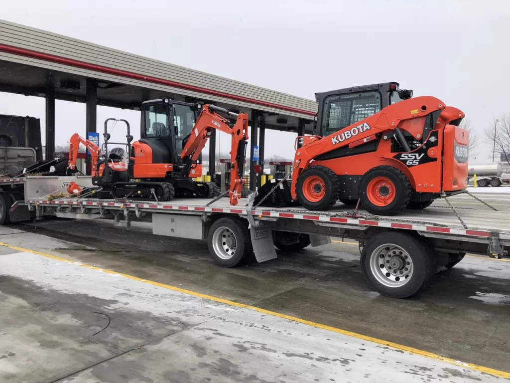 Construction equipment secured for transportation