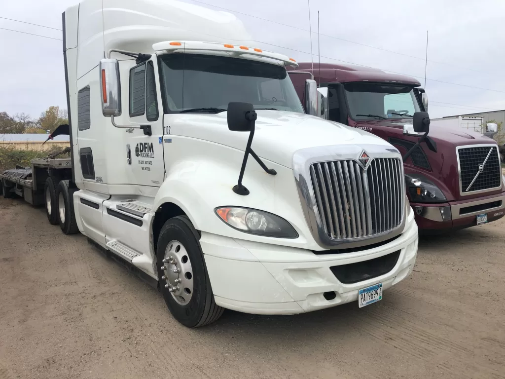 White DFM Trucking vehicle